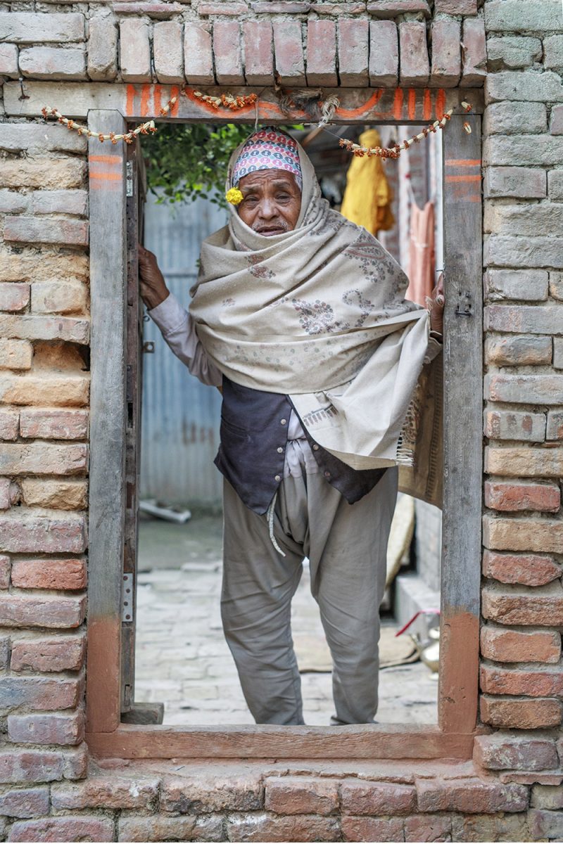An Elderly Woman at Her Doorway